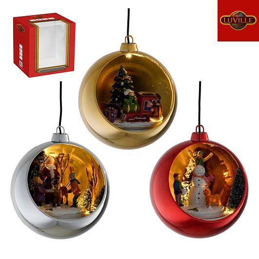 Roterende juleby julekule. Juletrepynt julelandsby